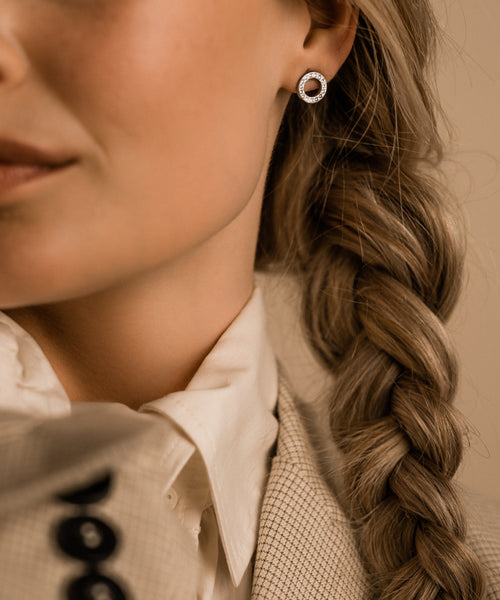 Hypoallergenic silver titanium brilliance crystal puck hollow earrings 