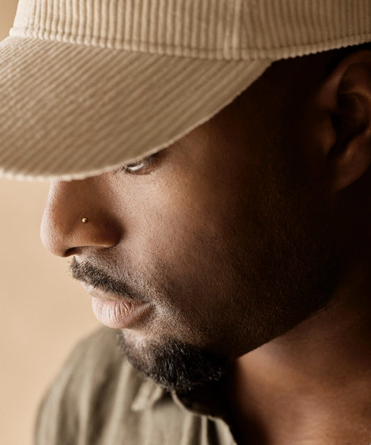 Hypoallergenic men's nose jewellery from titanium in a gold plain ball design