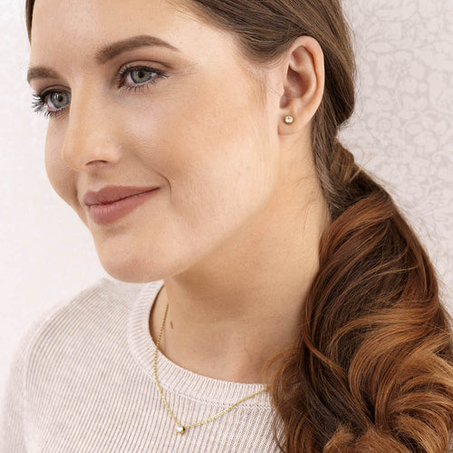 Blomdahl gold titanium 6mm Crystal Bezel Round hypoallergenic earrings with Swarovski crystal for adults and childrens.
