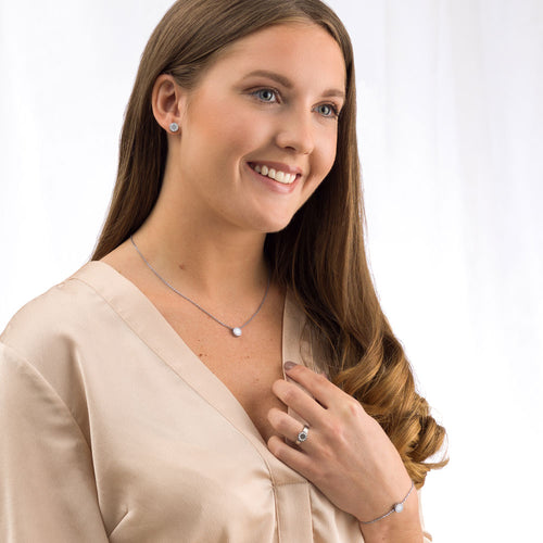 Blomdahl 8mm Silver Brilliance Puck earring set in pure medical grade titanium with a cluster of 11 small Swarvoski crystal surrounding the edge of the earrings for adults medical sensitive skin friendly nickel free