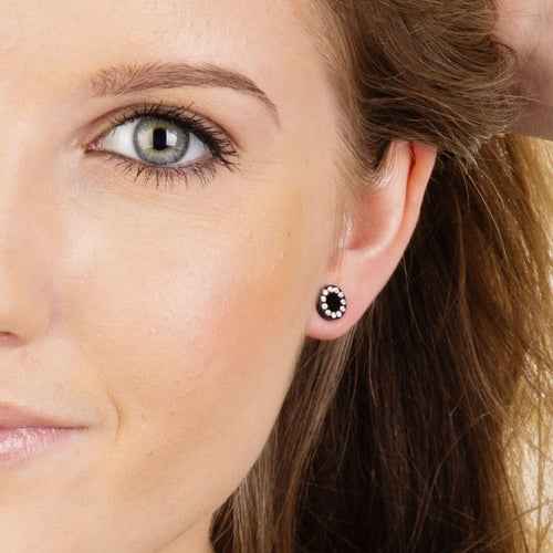 Blomdahl 8mm Black Brilliance Puck earring set in pure medical grade titanium with a cluster of 11 small Swarvoski crystal surrounding the edge of the earrings for adults  medical sensitive skin friendly nickel free