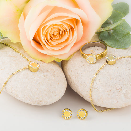 A collection of Gold Brilliance Puck Jewellery, consisting of earrings, necklace, ring and bracelet medical sensitive skin friendly nickel free