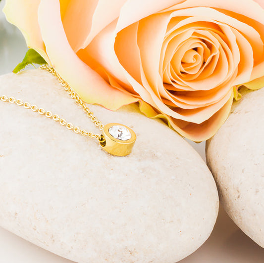 Gold Grand Bezel Necklace displayed on top of white stone medical sensitive skin friendly nickel free