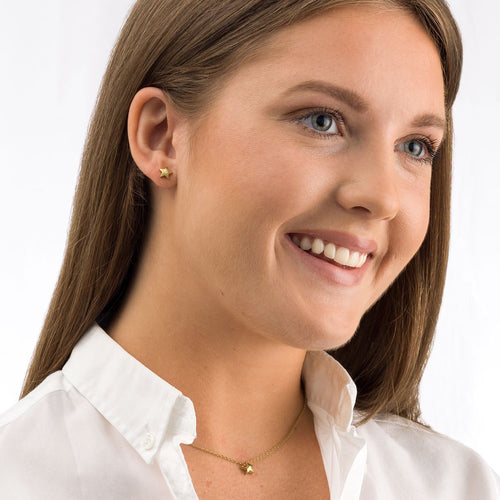 Model shoot for gold star and earrings - left orientation medical sensitive skin friendly nickel free
